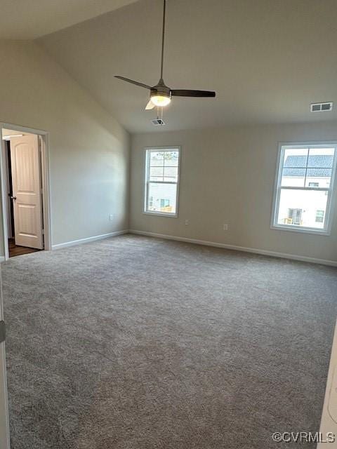 carpeted spare room with high vaulted ceiling and ceiling fan