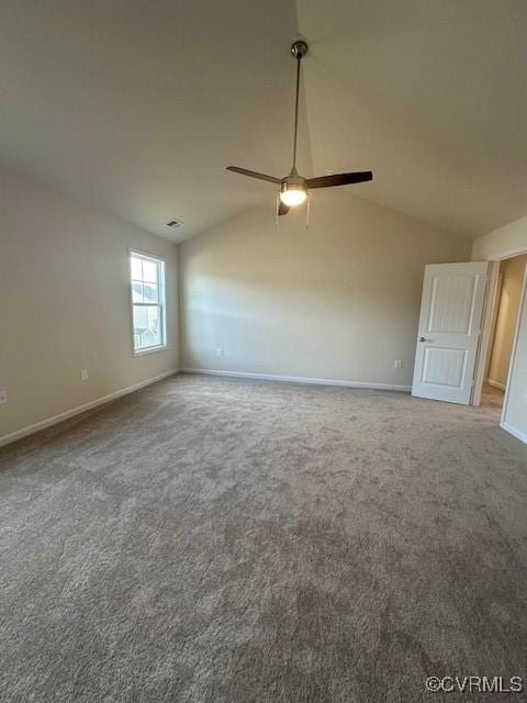 carpeted spare room featuring lofted ceiling and ceiling fan