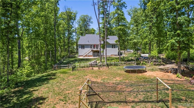 view of yard with a trampoline