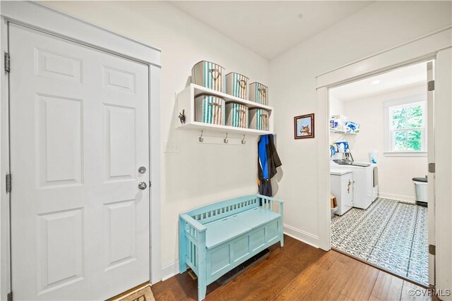 mudroom featuring dark hardwood / wood-style flooring and washer and clothes dryer