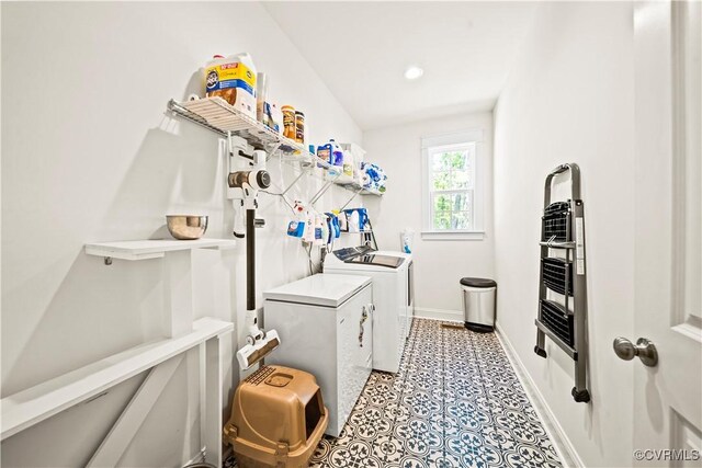 clothes washing area with independent washer and dryer