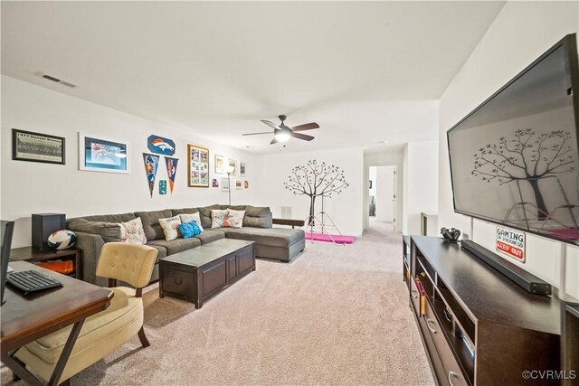 living room featuring light colored carpet and ceiling fan