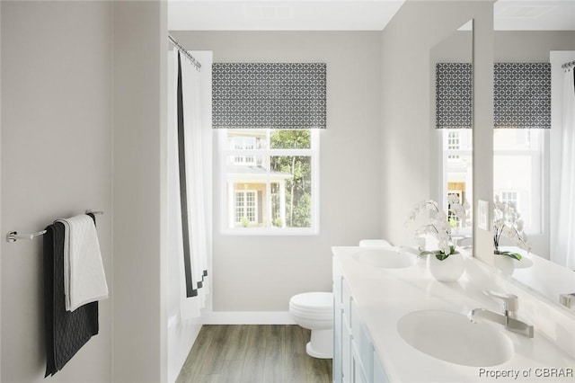 bathroom with toilet, vanity, a shower with curtain, and hardwood / wood-style flooring