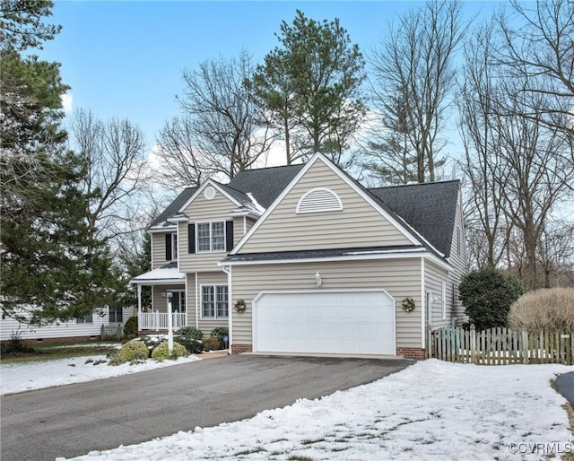 front facade with a garage and a porch