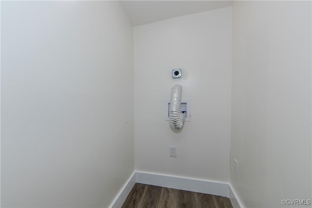 laundry room with dark hardwood / wood-style flooring and electric dryer hookup