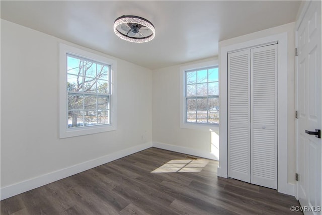 unfurnished bedroom featuring dark wood-type flooring