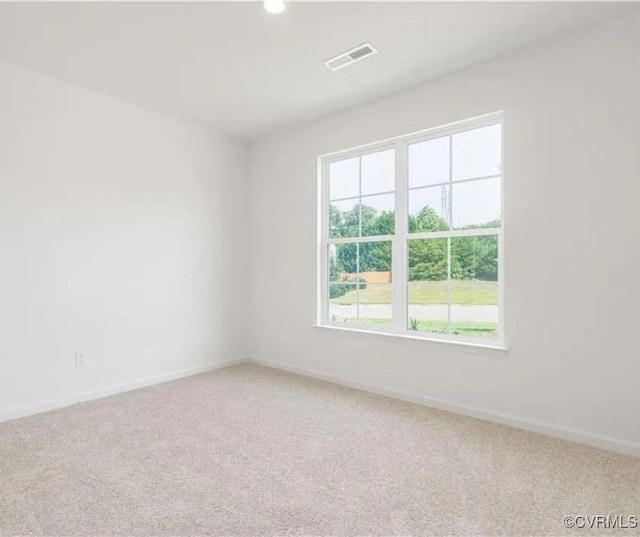 empty room with carpet flooring