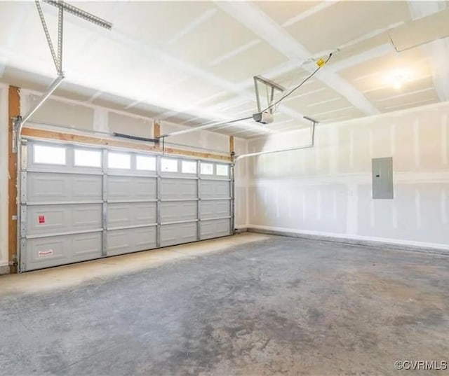 garage with a garage door opener and electric panel