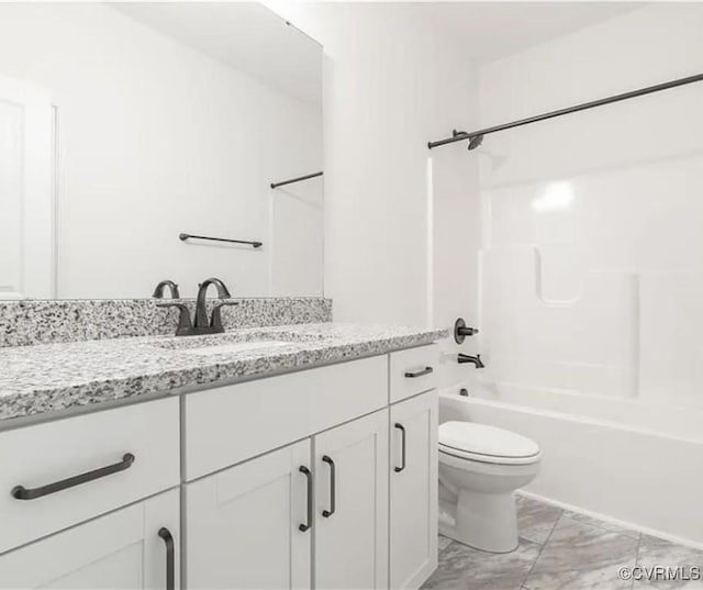 full bathroom with toilet, vanity, and  shower combination