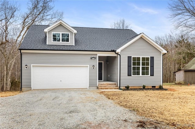 view of front facade featuring gravel driveway, an attached garage, a shingled roof, and crawl space