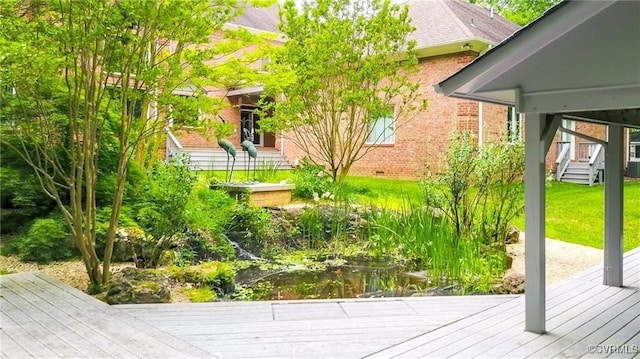 16460 W Crescent Ln, Hanover, VA 23192 - view of grassy yard featuring a deck and a small pond