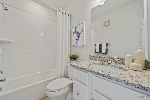 full bathroom featuring shower / bathtub combination with curtain, vanity, and toilet