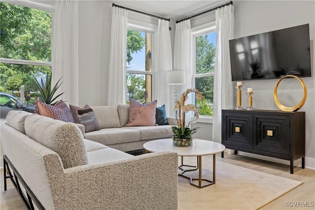 living room featuring light hardwood / wood-style flooring and plenty of natural light