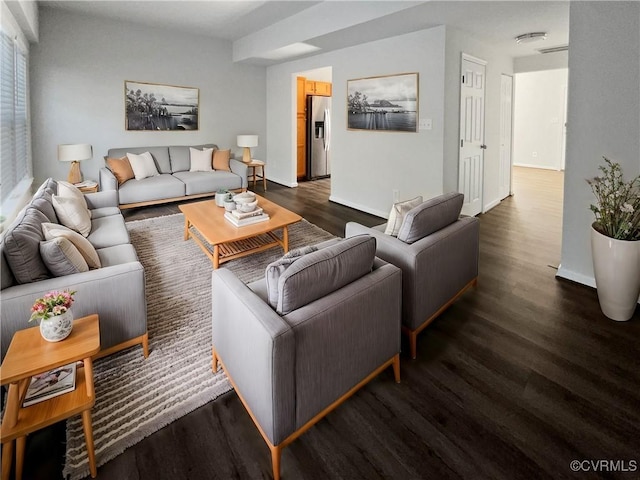 living room with dark hardwood / wood-style flooring