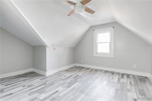 bonus room featuring ceiling fan, light hardwood / wood-style flooring, and vaulted ceiling