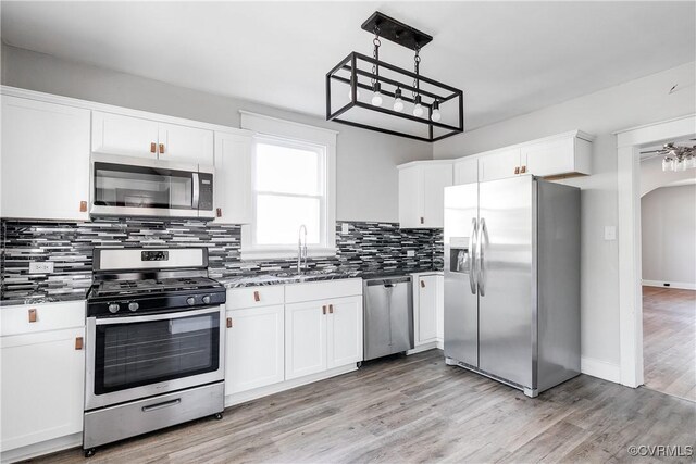 kitchen with white cabinetry, sink, and appliances with stainless steel finishes