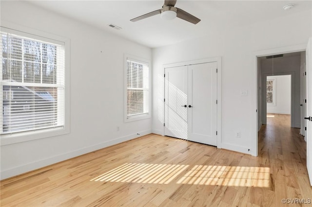 unfurnished bedroom featuring ceiling fan and hardwood / wood-style floors