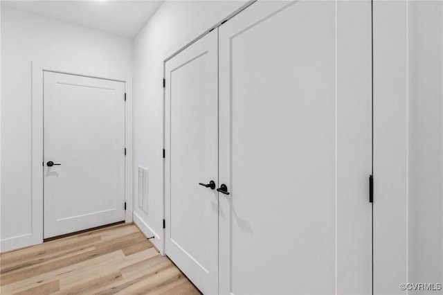 corridor featuring light wood-type flooring