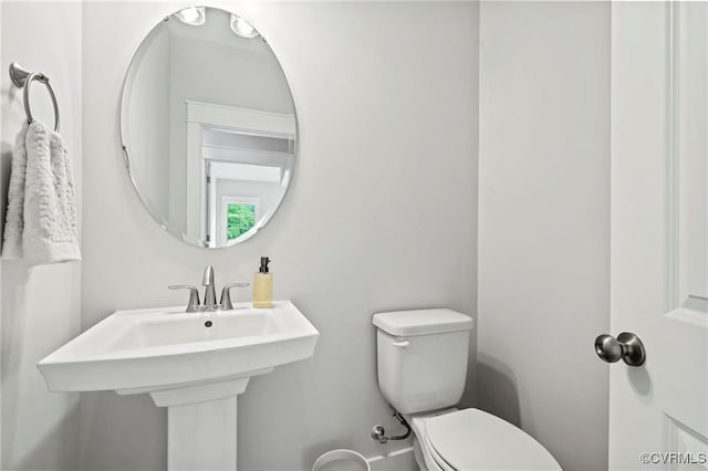 bathroom featuring sink and toilet