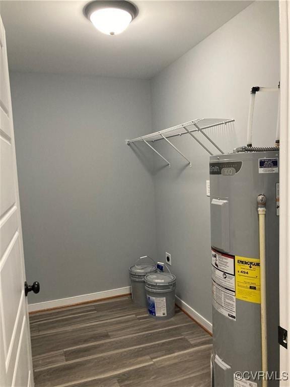 utility room featuring water heater