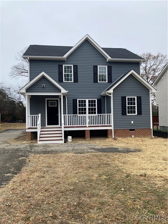 view of front of property featuring covered porch