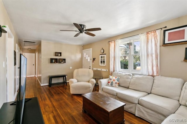 living room with dark hardwood / wood-style flooring and ceiling fan