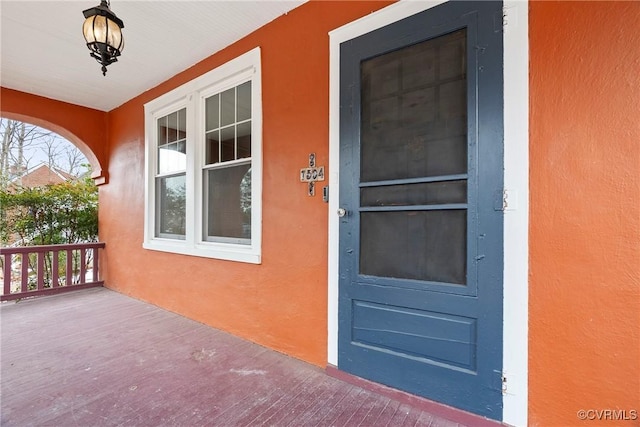 property entrance featuring a porch