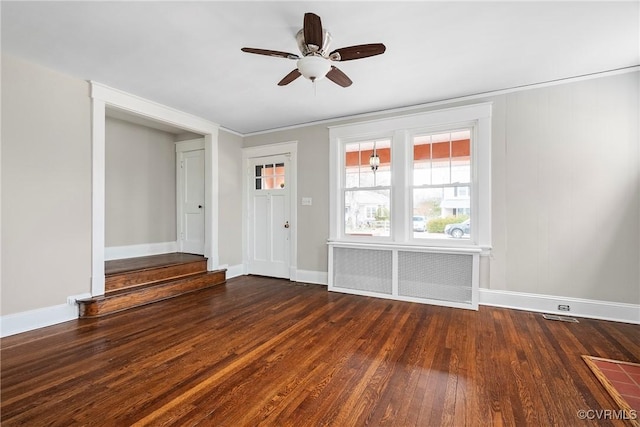 interior space featuring ceiling fan and dark hardwood / wood-style flooring