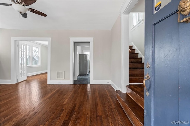 foyer entrance featuring ceiling fan and dark hardwood / wood-style floors