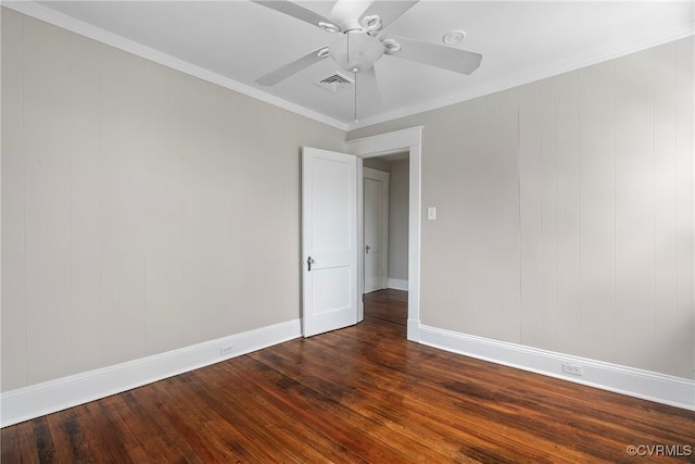 spare room featuring ceiling fan, dark hardwood / wood-style flooring, and crown molding