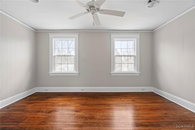 unfurnished room featuring dark hardwood / wood-style floors, a wealth of natural light, and crown molding