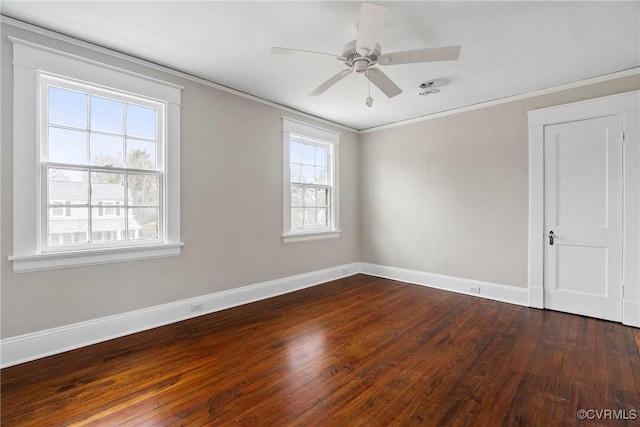 unfurnished room with ceiling fan, a wealth of natural light, dark hardwood / wood-style floors, and crown molding