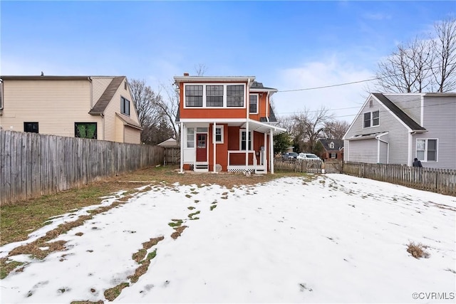 view of snow covered house