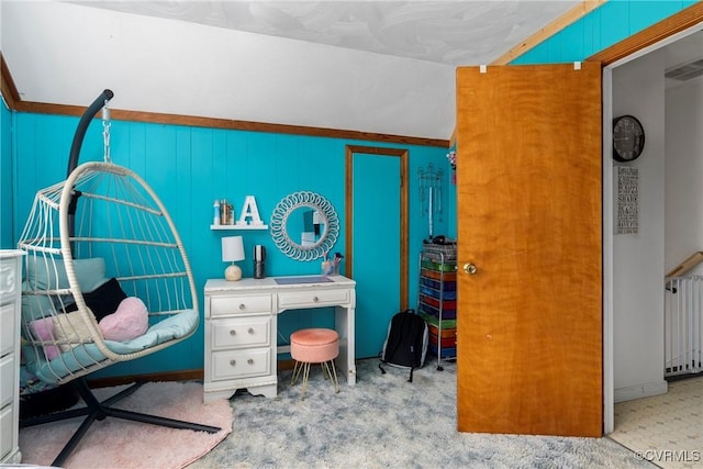 interior space featuring light colored carpet and radiator