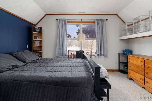 carpeted bedroom featuring vaulted ceiling