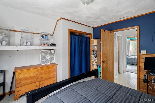 bedroom with ornamental molding