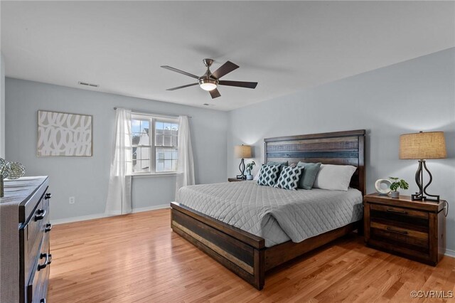 bedroom with light wood-type flooring and ceiling fan