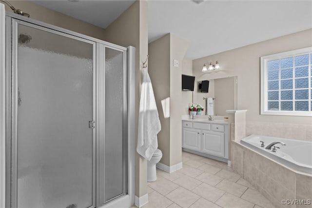 bathroom featuring vanity, a wealth of natural light, separate shower and tub, and tile patterned flooring