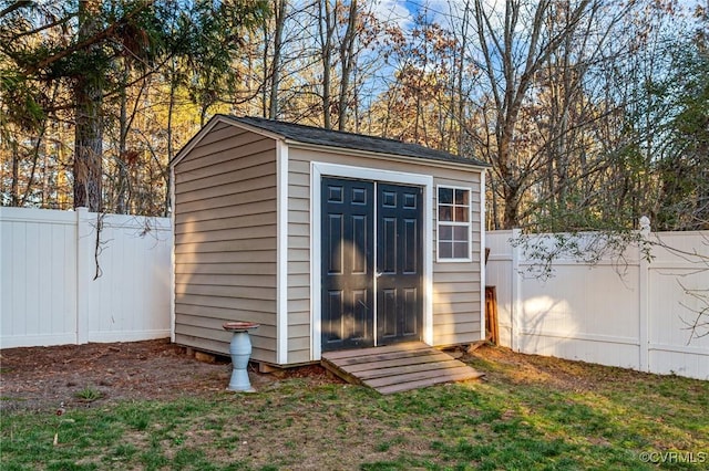 view of outbuilding featuring a yard