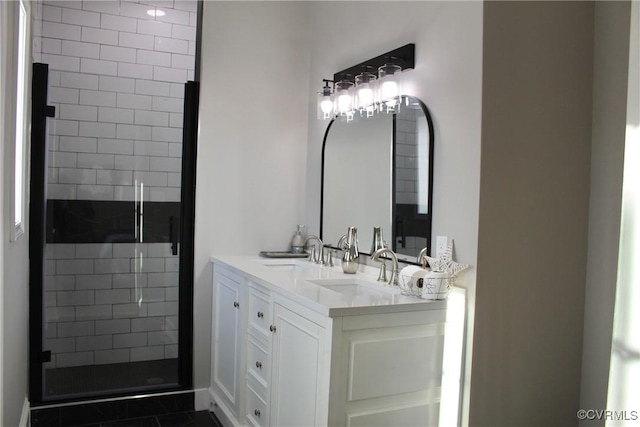 bathroom with vanity, tile patterned floors, and a shower with shower door