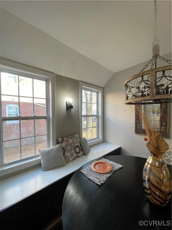 dining room with vaulted ceiling