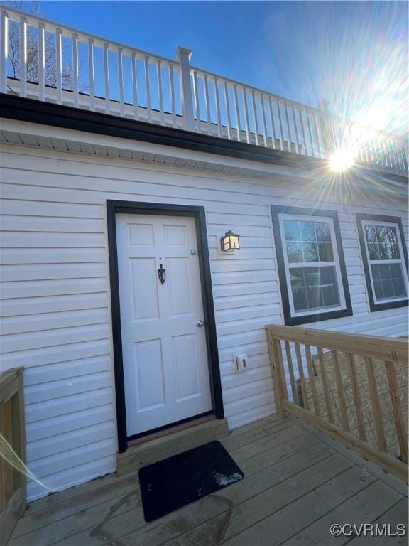 doorway to property featuring a deck