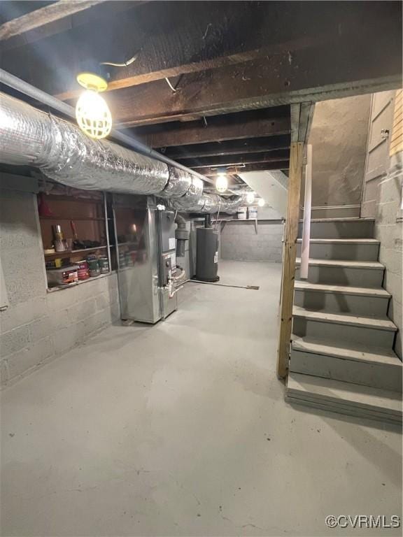 basement with water heater and heating unit