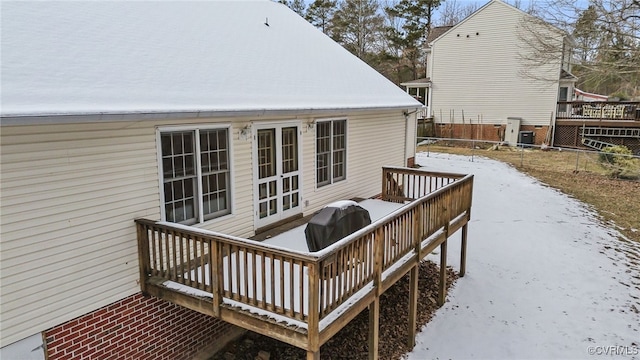 view of snow covered deck