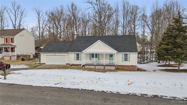 view of front of property with a porch and a garage