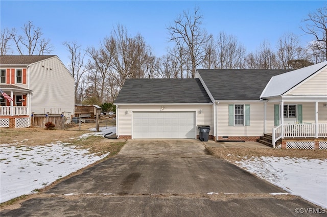 view of snow covered exterior with a garage