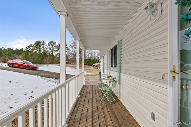 wooden deck featuring a porch