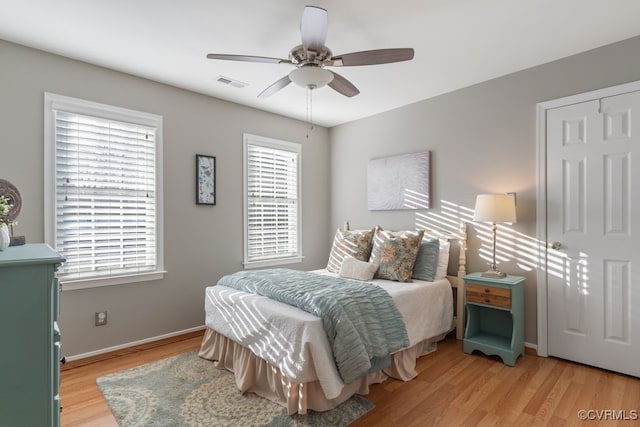 bedroom featuring ceiling fan and light hardwood / wood-style flooring