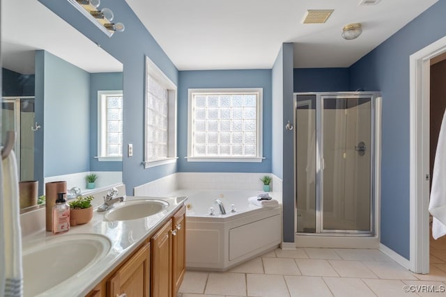 bathroom with vanity, tile patterned flooring, and separate shower and tub