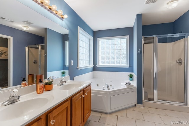 bathroom with separate shower and tub, vanity, and tile patterned floors